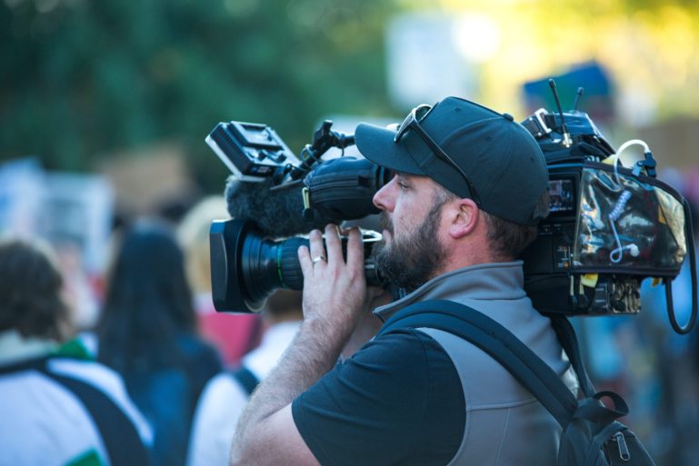 Australia TV Film man with camera shooting
